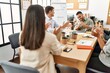 © Krakenimages.com - Group of business workers smiling and clapping to partner at the office.
