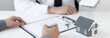 © Puwasit Inyavileart - Real estate agent or sales manager has offered home sales and explained the terms of signing the house purchase contract and free home insurance, Finance and after-sales service concept.