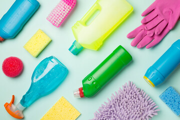 Many different house cleaning products on color background, top view