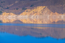 The Wake From A Boat Ripples Leaves Ripples On Lake Cachuma In Santa Barbara County, CA.