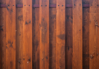 Wall Mural - Old plank wooden wall background. The texture of old wood. Weathered piece of wood.