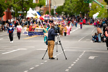A Camera Man Broadcasting Parade