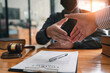 © crizzystudio - Lawyers shake hands with business people to seal a deal with partner lawyers. or a lawyer discussing contract agreements, handshake concepts, agreements, agreements