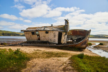 Naklejka na meble Side profile of shipwreck resting on sandy beach