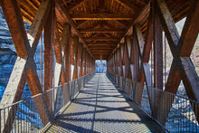 Looking Down Long Walking Bridge Of Wood And Metal