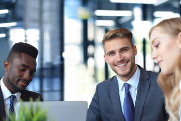 Sticker - Businessman with colleagues in the background in office.