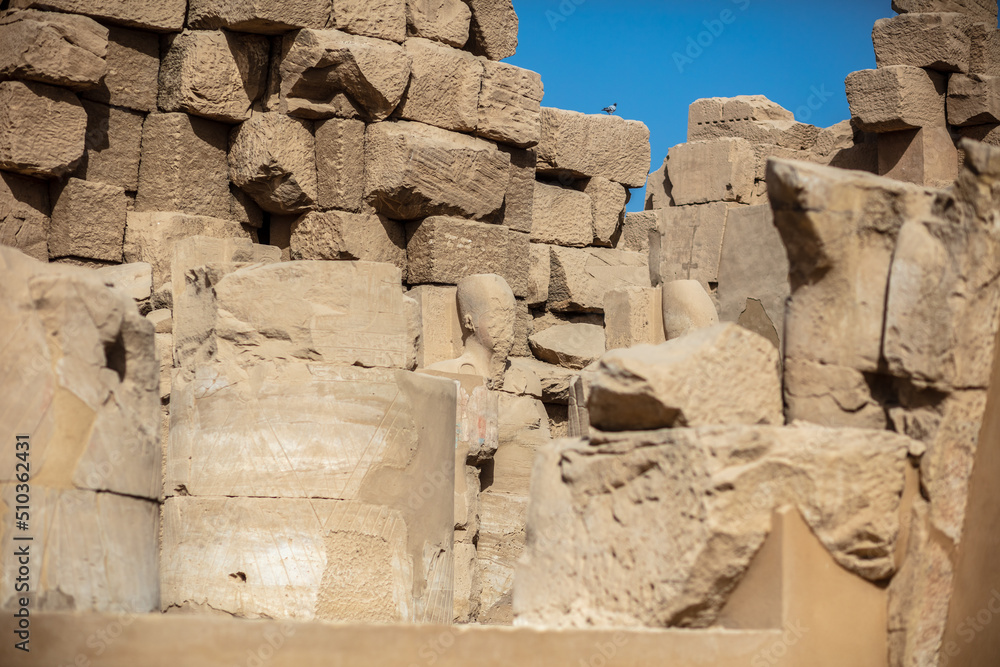 Statues of ancient Egyptian pharaohs and gods. Various hieroglyphs on ...