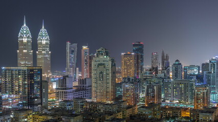 Sticker - Skyscrapers in Barsha Heights district and low rise buildings in Greens district aerial night timelapse.