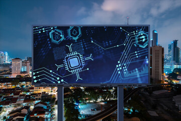 Information flow hologram on road billboard, night panorama city view of Kuala Lumpur. KL is the largest technological center in Malaysia, Asia. The concept of programming science.