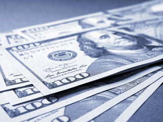 Wall Mural - american paper money. several one hundred dollar notes lie on textured surface. focus on the number 