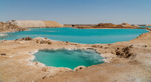 Amazing View Of The Salt Lakes In Siwa, Egypt. Beautiful Colorful Water Surrounded By The Desert