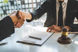 © crizzystudio - Handshake after good cooperation counseling lawyer business lawyers working about legal legislation, Consultation between a male lawyer and businessman customer, and the company of real estate concept