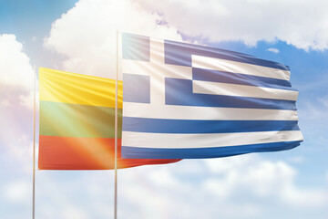 Sunny blue sky and flags of greece and lithuania