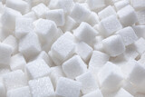 Fototapeta  - Rafinated sugar. Textured white background from sugar cubes.