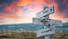 Open For Business Text Quote Caption On Wooden Signpost Outdoors In Nature With Dramatic Sunset Skies. Panorama Crop.