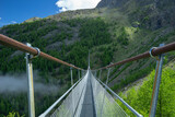Fototapeta Miasto - The Charles Kuonen Suspension Bridge in the Swiss Alps
