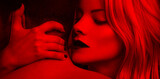 Fototapeta  - Blonde woman in red lips seducing man closeup in red light