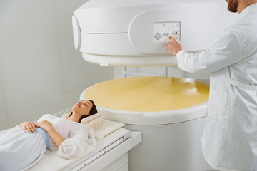 Wall Mural - Woman patient is ready to do magnetic resonance imaging MRI or CT scan in clinic