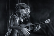 Harlequin Puppet Doll On Strings With Selective Focus Black And White