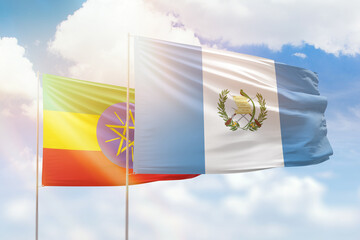 Sunny blue sky and flags of guatemala and ethiopia