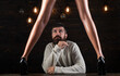 © Volodymyr - Couple playing with sexy legs. Handsome man holding womans leg in elegant shoes.