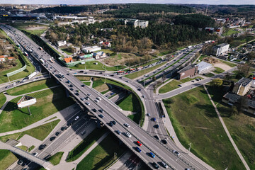 Capital city round about and juncture roads from aerial perspective in urban environment