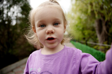 little caucasian girl taking a selfie, little blogger