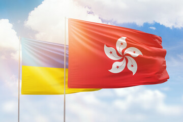 Sunny blue sky and flags of hong kong and ukraine