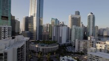 Aerial Shot Of Modern Residential Buildings Against Clear Sky, Drone Flying Upwards On Sunny Day In City - Miami, Florida