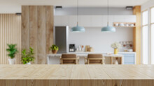 Wooden Table Top On Blur Kitchen Room Background,Modern Contemporary Kitchen Room Interior.
