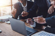 © amnaj - Business people discuss investment project working and planning strategy on laptop computer. Business meeting talking, planning analyze investment and marketing in office.