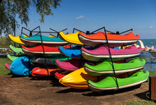Many Colorful Plastic Boats For Rent On Land