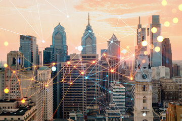 Aerial panoramic cityscape of Philadelphia financial downtown, Pennsylvania, USA. City Hall Clock Tower, sunset. Social media icons. The concept of networking and establishing people connections