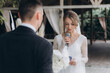 © Олег Блохин - Beautiful space wedding ceremony in the summer of a chic couple, the groom in a suit and the bride in a white luxurious wedding dress.