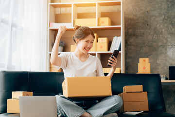 Wall Mural - Asian woman working in modern warehouse and delivery service via modern technology