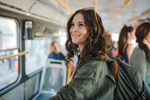 Mid Adult Woman Commuter Is Standing In Bus And Travelling In Public Transport.