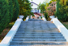 High Stone Staircase And Steps To The House And Garden Around