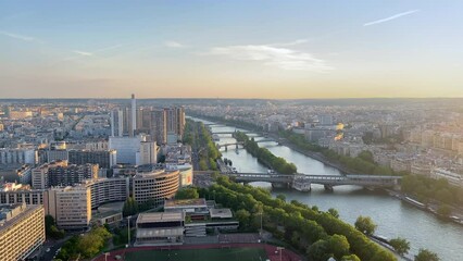 Wall Mural - Panorama on the Ile aux Cygnes island, Beaugrenelle district, the river Seine and Bir-Hakeim bridge at sunset in Paris, France