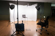 © Kolombo Castro - Filming set with lights, cameras and white background.