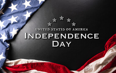 Happy Independence day concept made from American flag on dark wooden background.