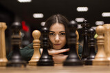 Fototapeta Mapy - beautiful girl playing chess