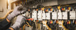 © kunakorn - Electricity and electrical maintenance service, Engineer hand holding AC multimeter checking electric current voltage at circuit breaker terminal and cable wiring main power distribution board.