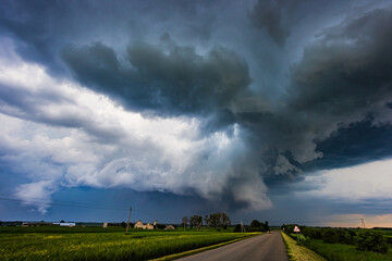 storm clouds over field, tornadic supercell, extreme weather, dangerous storm