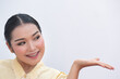 © 9nong - Woman pointing up her hand to blank space
