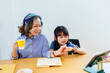 © Jirapong - Asian portrait, grandchild granddaughter grandma grandmother and granddaughter happily join in activities to enjoy eating and enhance skills for grandchildren
