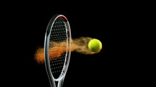 Freeze Motion Of Tennis Racket Hitting The Ball