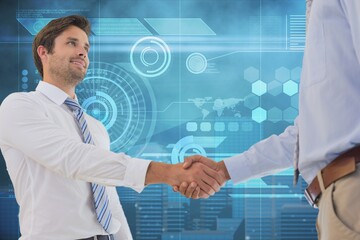 Canvas Print - Two diverse businessmen shaking hands against digital interface with data processing