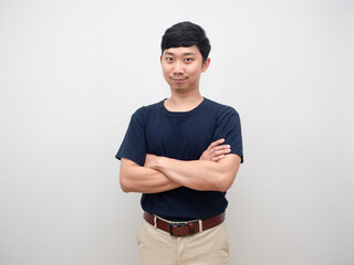 Portrait young man confident cross arm studio shot white background