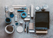© Cavan Images - Top view flat lay of painting supplies arranged on grey background.