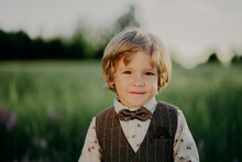 Portrait Of Handsome Little Boy In Festive Costume With Butterfly